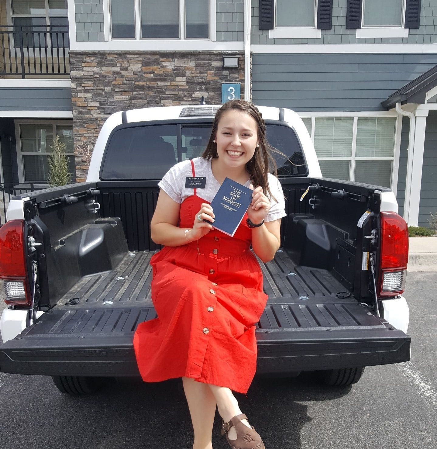 Sister Blalock on truck in Denver Mission